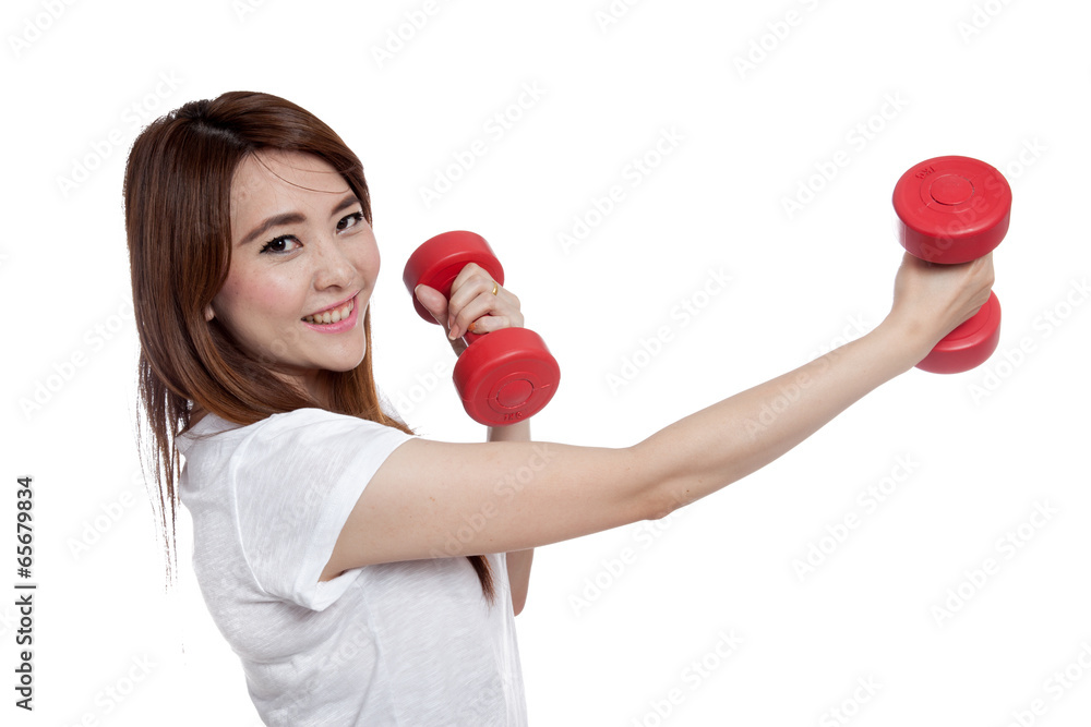 Asian girl exercise with red dumbbells and smile very happy Asian girl exercise with red dumbbells and smile very happy
