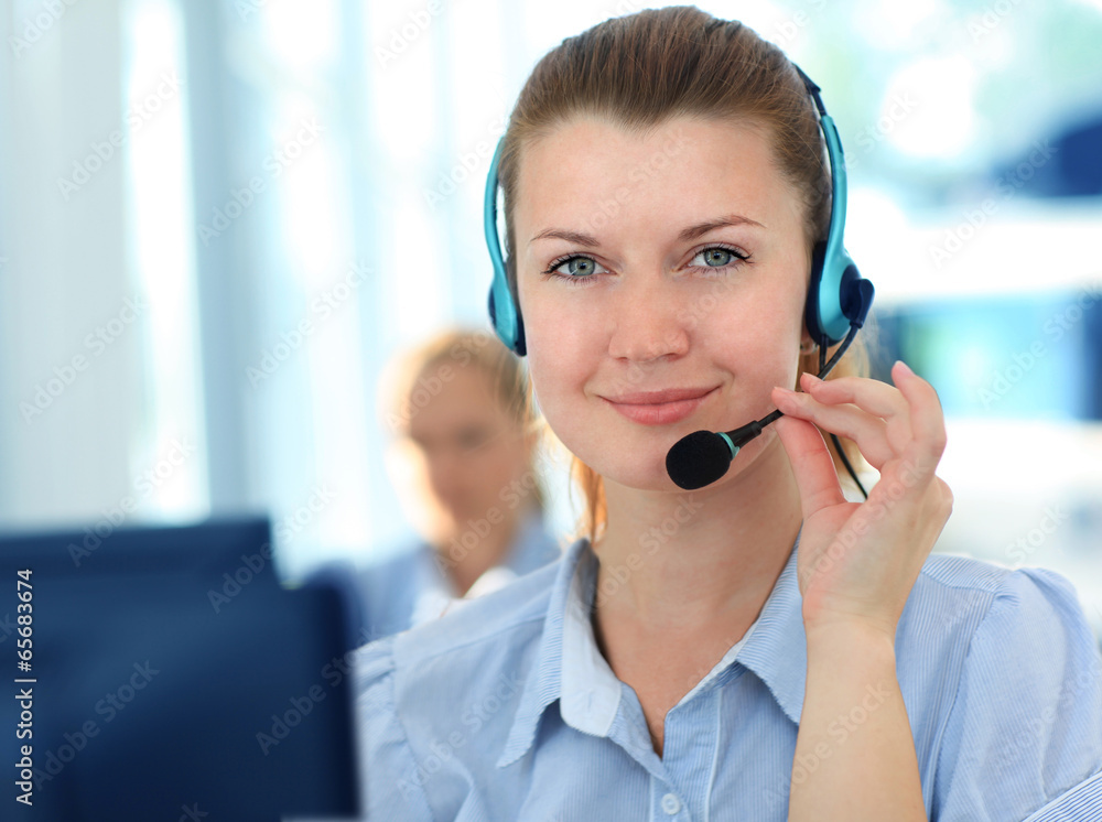Female customer support operator with headset and smiling Female customer support operator with headset and smiling