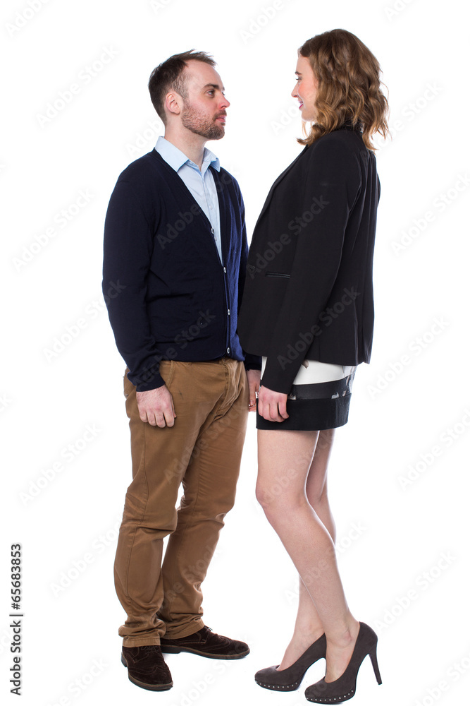 Tall woman confronting a shorter man Stock Photo