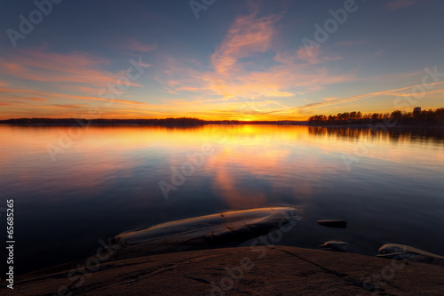 Still sea water with sunrise in coast of Helsinki © arska n