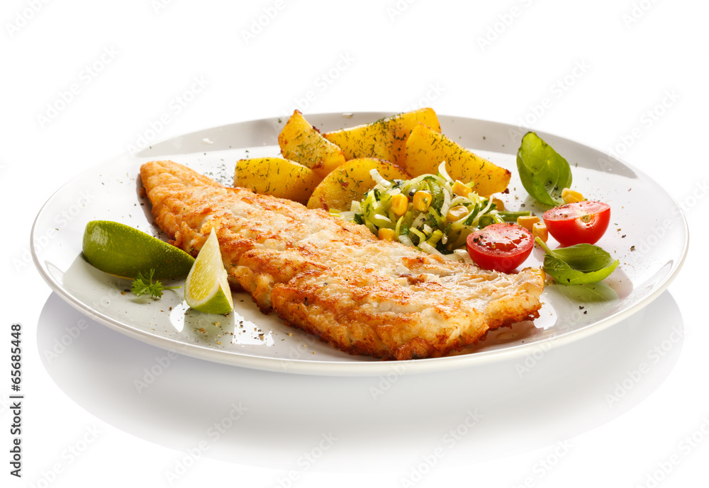 Fish dish - fried fish fillet with vegetables Fish dish - fried fish fillet with vegetables