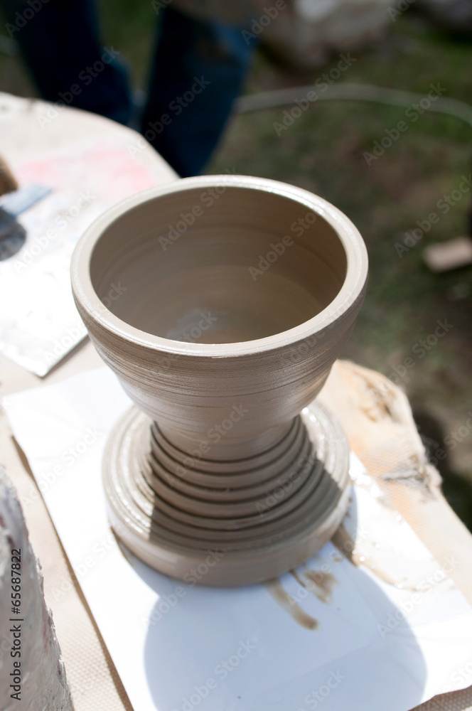 Pottery - formation process of the clay dish with traditional me Pottery - formation process of the clay dish with traditional me