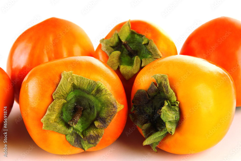 Ripe persimmons isolated on white Ripe persimmons isolated on white