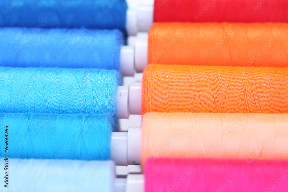 Multicolor sewing threads background Multicolor sewing threads background