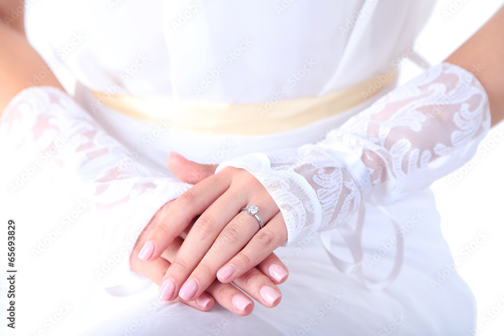 Obraz premium Wedding gloves on hands of bride, close-up