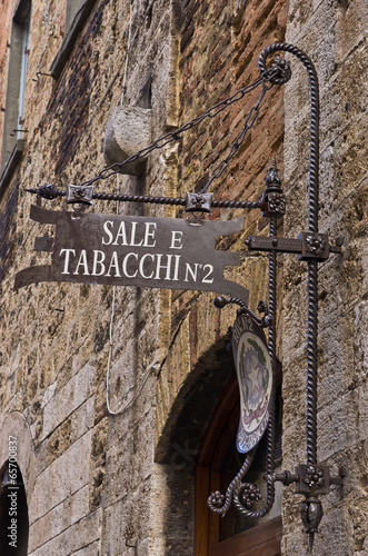 Old tobacco shop in old medieval building at San Gimignano