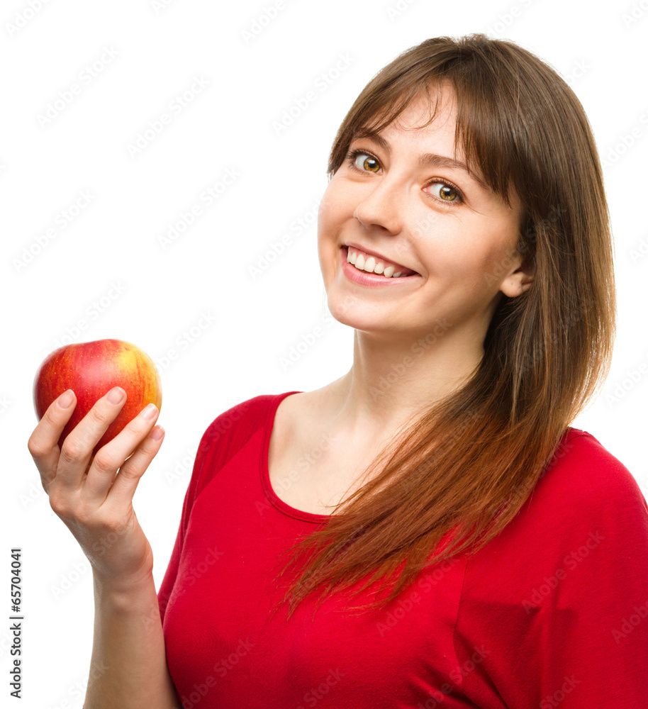 Young happy girl with apple Young happy girl with apple