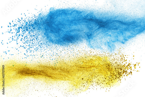 Blue and yellow powder explosion isolated #65707849