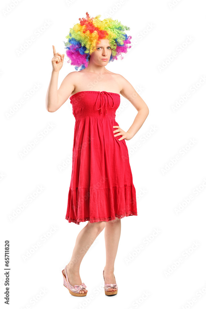 Young girl with wig pointing up with finger Young girl with wig pointing up with finger