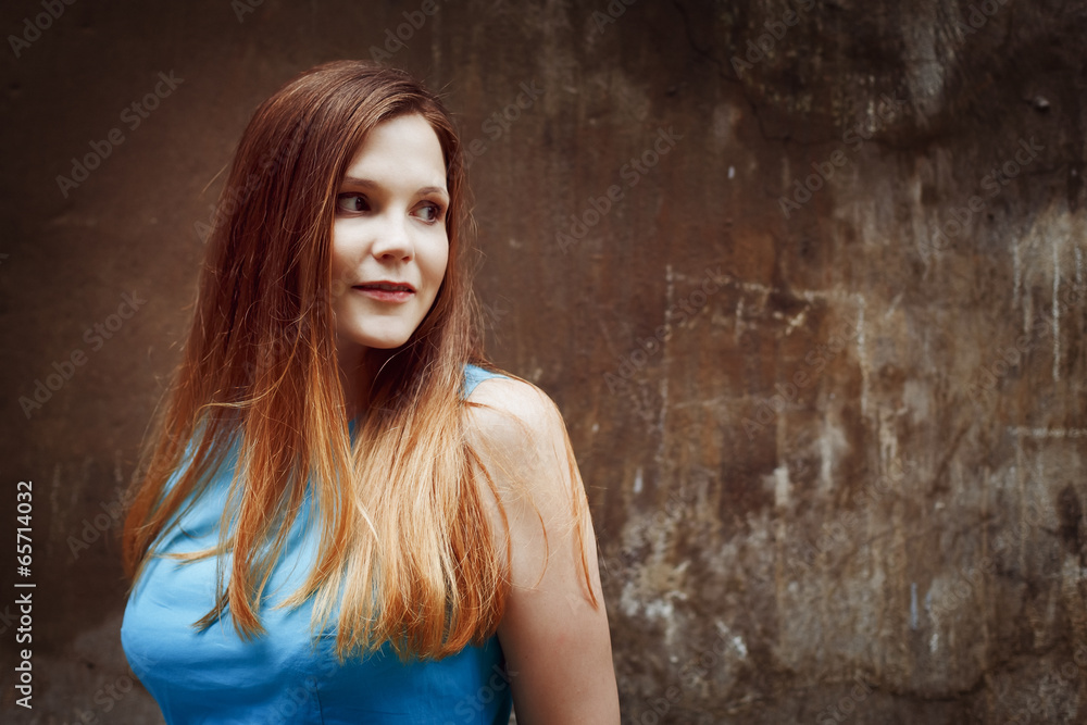 Fototapeta premium Beautiful red-haired young woman