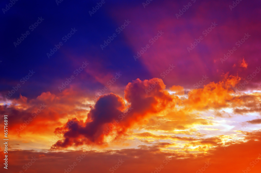 cloudscape at sunset with sun rays