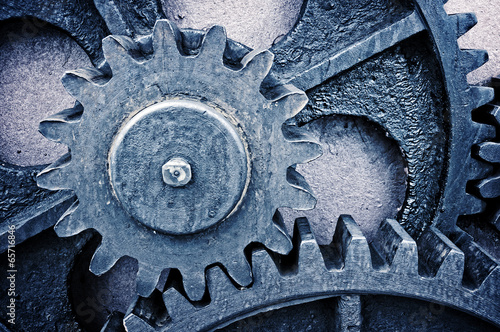 rusty and metallic gear wheel