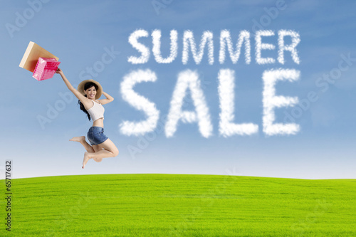 Happy woman with cloud of summer sale