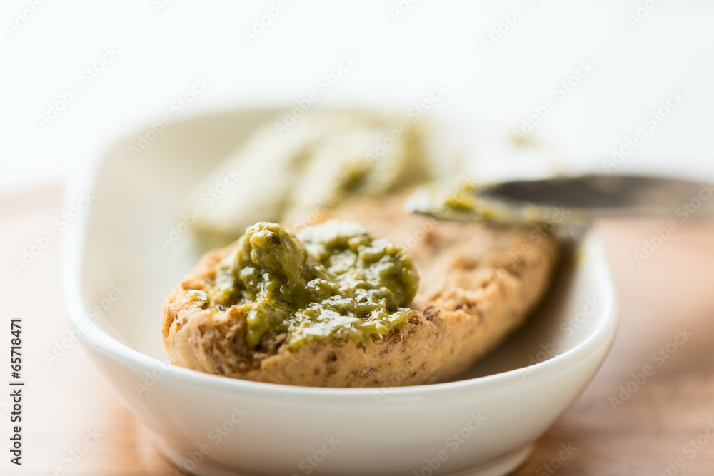 Toast with pesto sauce in bowl macro Toast with pesto sauce in bowl macro