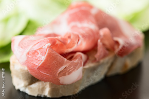 Ham Sandwich on black plate horizontal