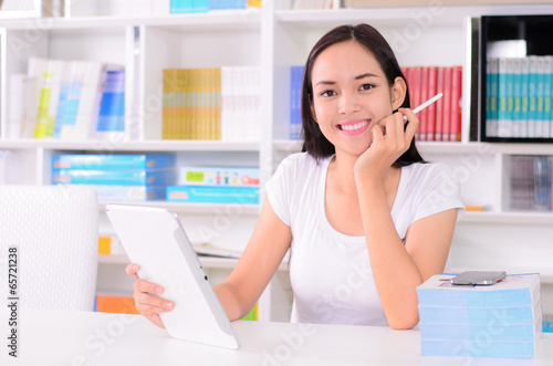 Beautiful young student happy with phone