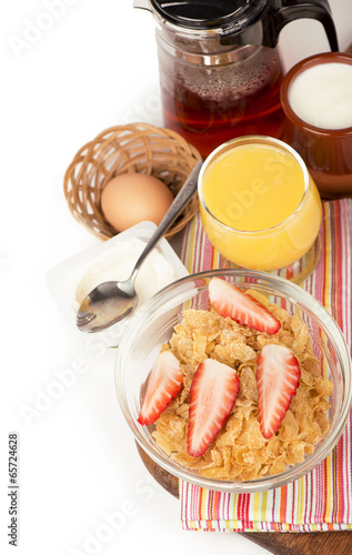 Fototapeta Naklejka Na Ścianę i Meble -  Breakfast including orange juice, muesli and fruits