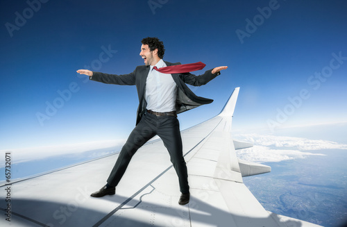 Businessman riding an airplane photo