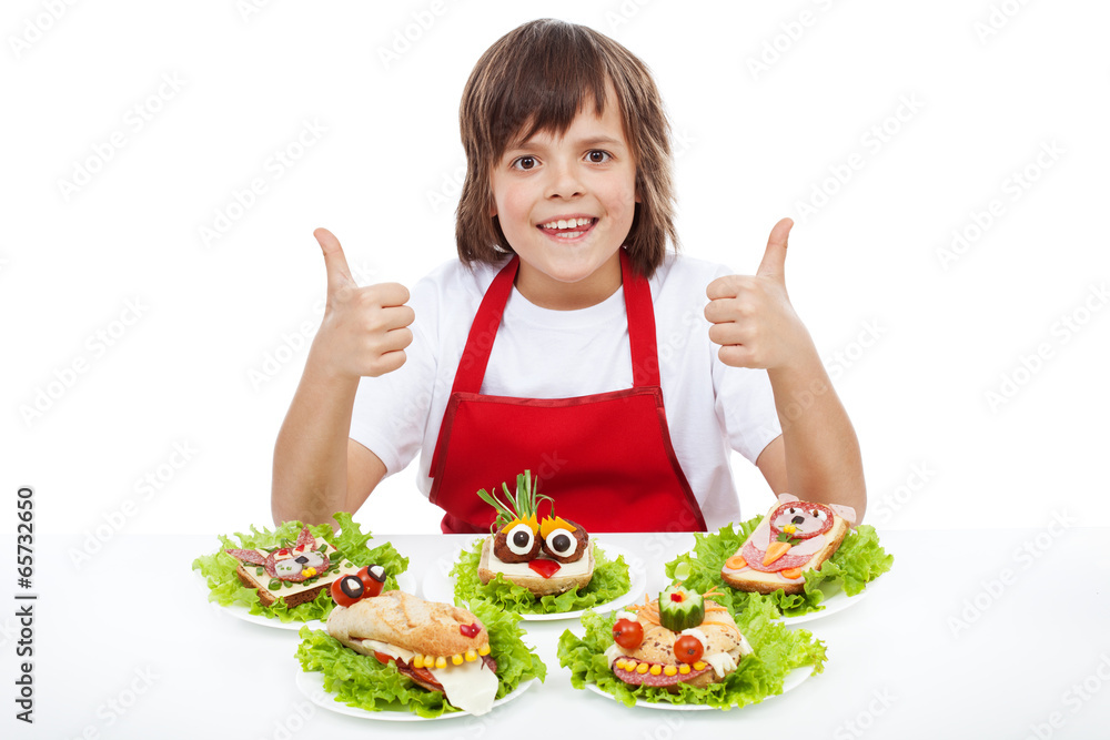 Happy chef boy with creative sandwiches Happy chef boy with creative sandwiches
