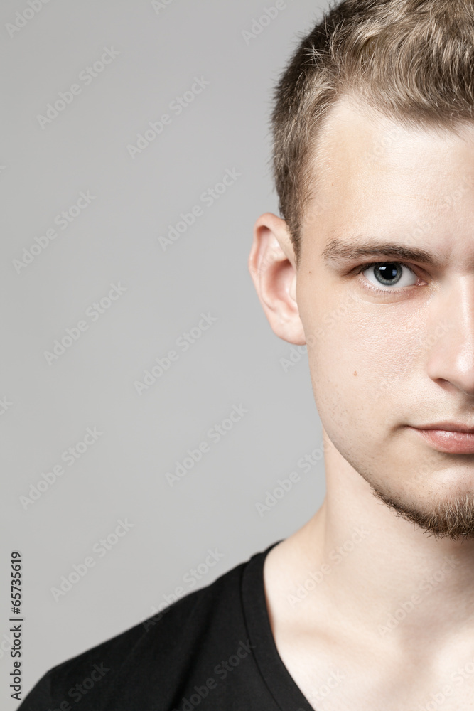 Obraz premium closeup portrait of young man isolated on light background