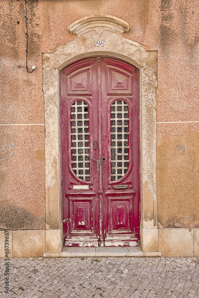 dark red door in ancient portuguese town of faro dark red door in ancient portuguese town of faro