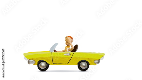 Man driving a convertible vintage car, alpha matte, stop motion.