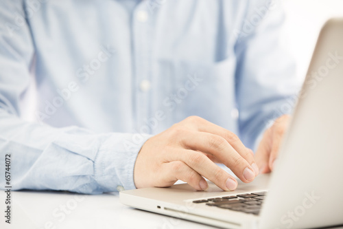 Close-up of Businessman using laptop