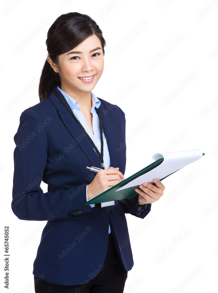 Business woman take note on clipboard Business woman take note on clipboard