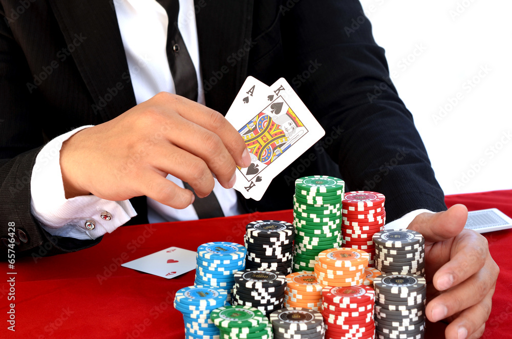 Young handsome man playing texas hold'em Young handsome man playing texas hold'em