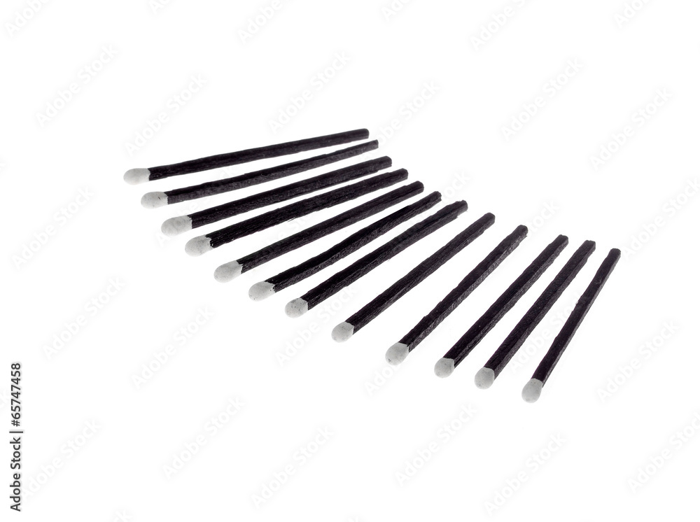 Black and White Matches isolated against a white background . Black and White Matches isolated against a white background .