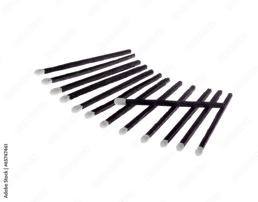 Black and White Matches isolated against a white background . Black and White Matches isolated against a white background .