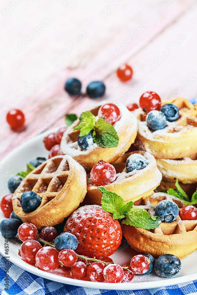 Waffles with fresh berries on the table