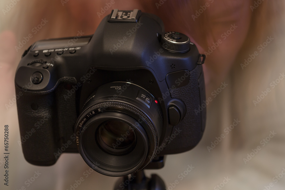 Photographer - Modern DSLR with 50 mm lens