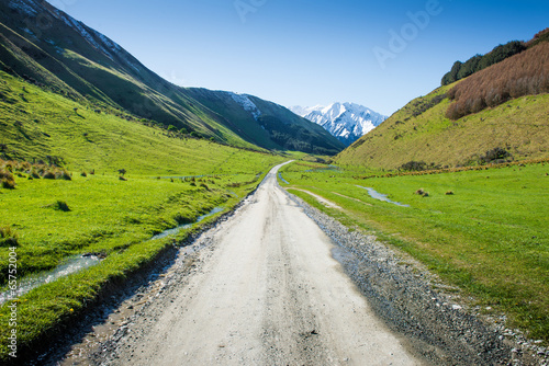 Landscape with dirt road in the mountains , New Zealand