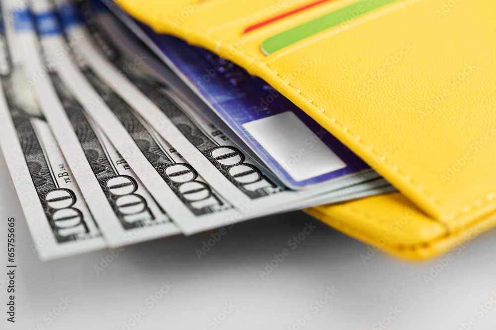 US dollars bills and credit card in wallet. US dollars bills and credit card in wallet.