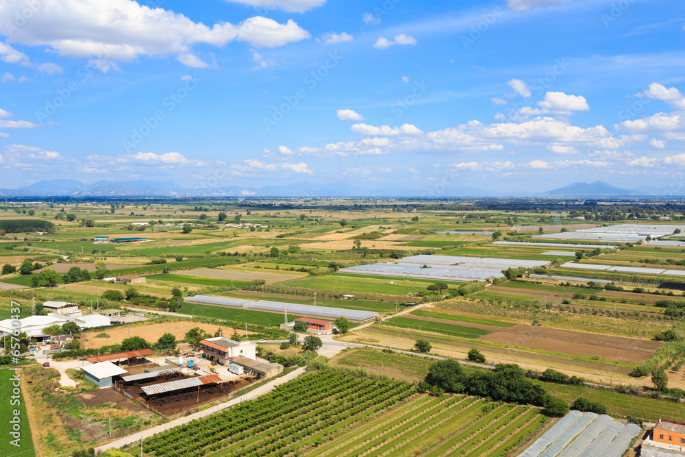 aerial view of farmland and vesuvio mountain background