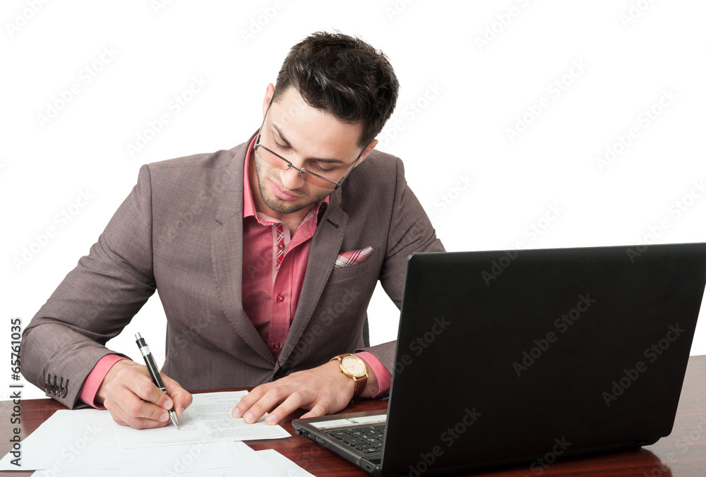 Young and handsome manager signing business documents. Young and handsome manager signing business documents.