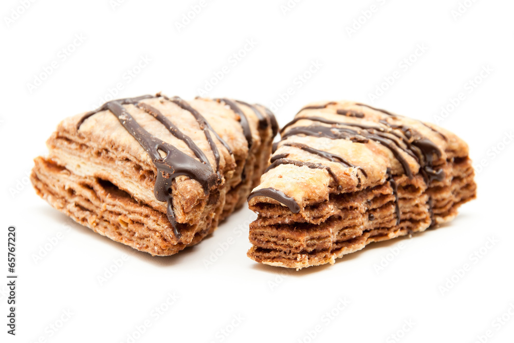Flaky chocolate chip cookies on a white background