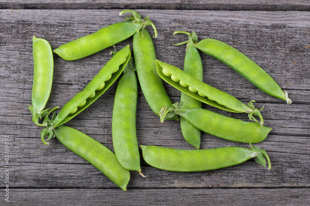 Broad beans of peas on old wood background Broad beans of peas on old wood background