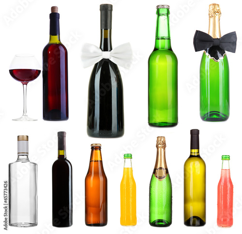 Collage of different alcohol bottles isolated on white