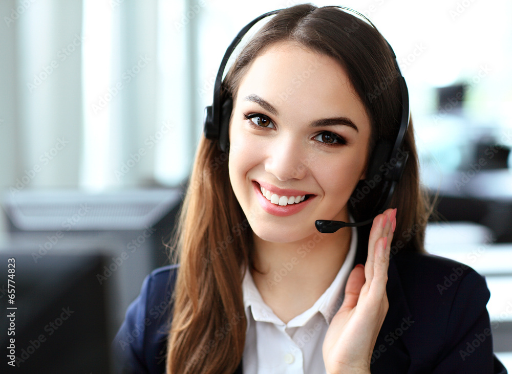 Female customer support operator with headset and smiling Female customer support operator with headset and smiling