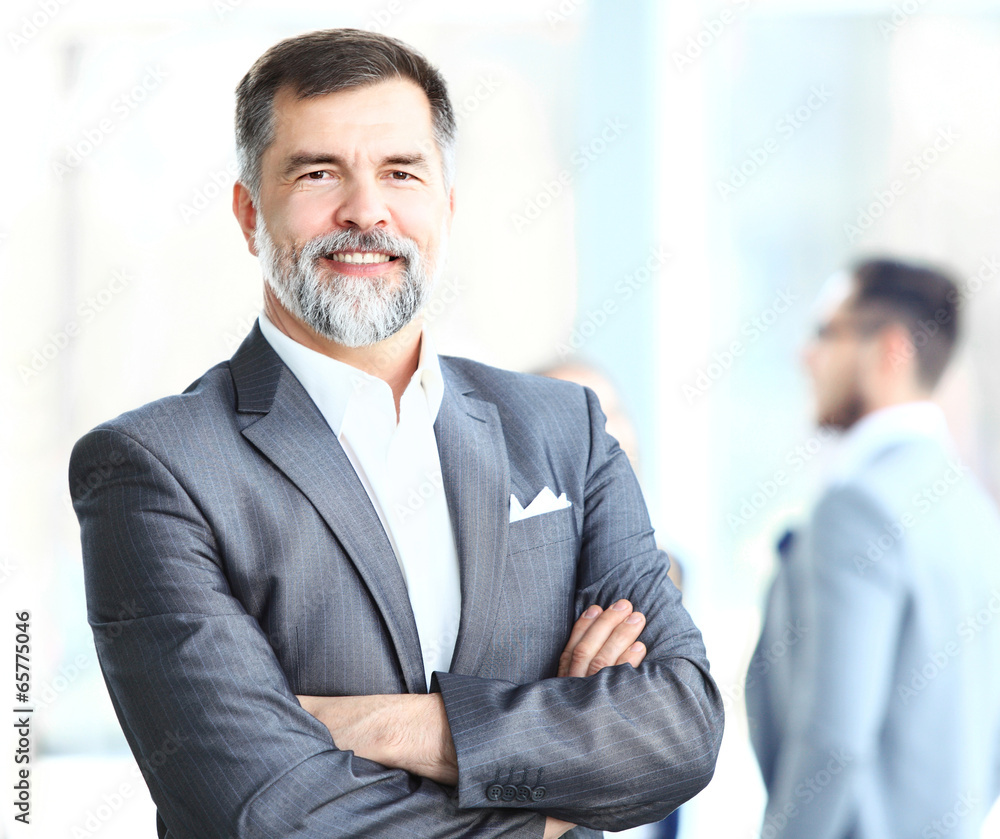 Portrait of a happy senior business man smiling Portrait of a happy senior business man smiling
