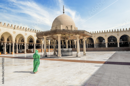 The girl in the national Egyptian attire in the mosque of AMR Ib