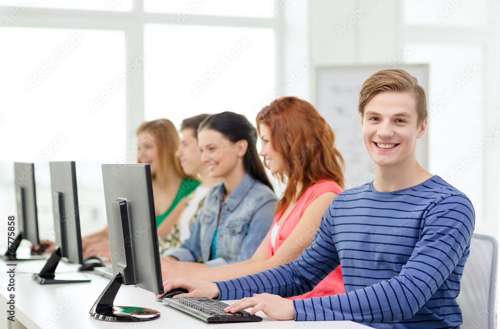 male student with classmates in computer class male student with classmates in computer class