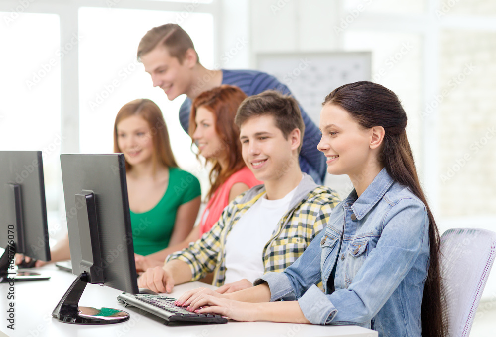 female student with classmates in computer class female student with classmates in computer class