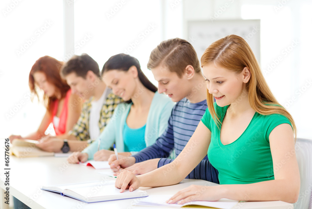 students with textbooks and books at school students with textbooks and books at school