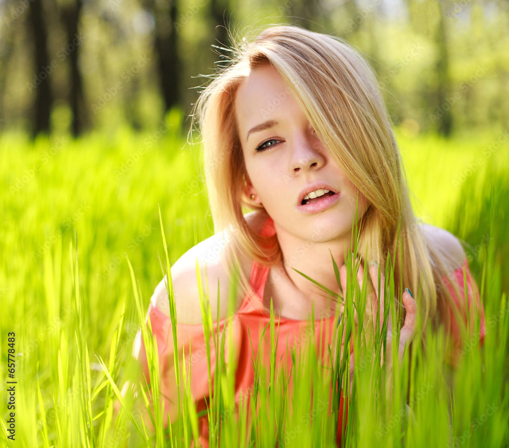 Sensual girl in green grass on a background of nature Sensual girl in green grass on a background of nature