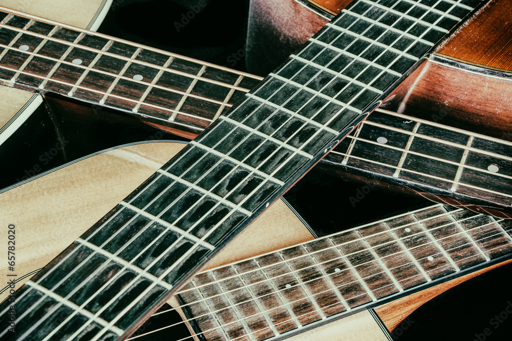 Fototapeta premium Vintage Acoustic Guitar Necks Crossed