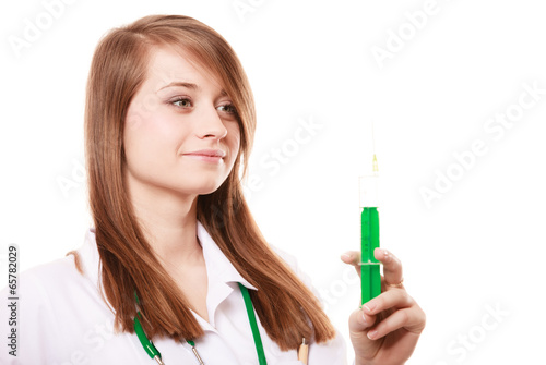 Medical. Woman doctor in lab coat with syringe