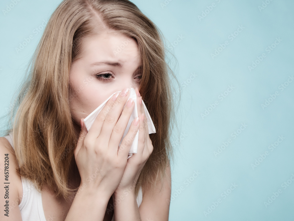 Flu allergy. Sick girl sneezing in tissue. Health Flu allergy. Sick girl sneezing in tissue. Health